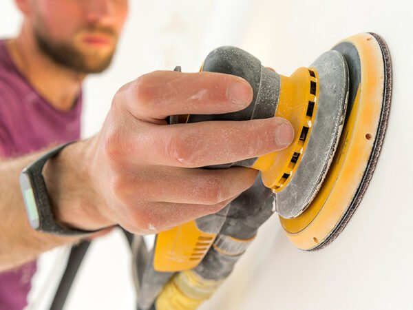 Worker using a sander