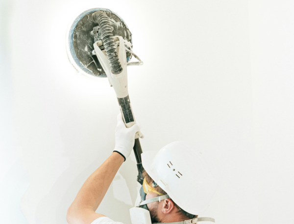 Person using sander with dust collection